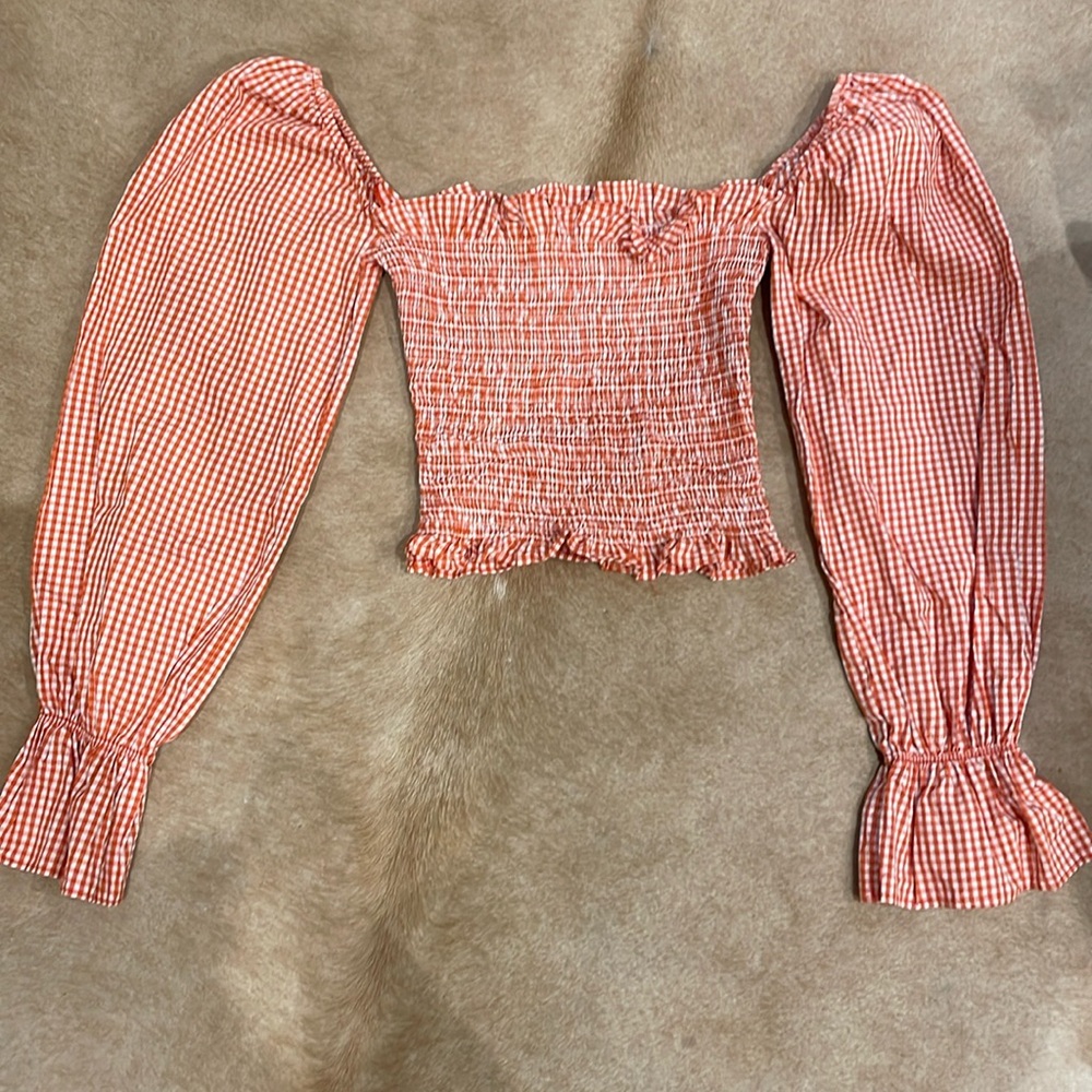 Le semiane Paris smocked red gingham blouse.